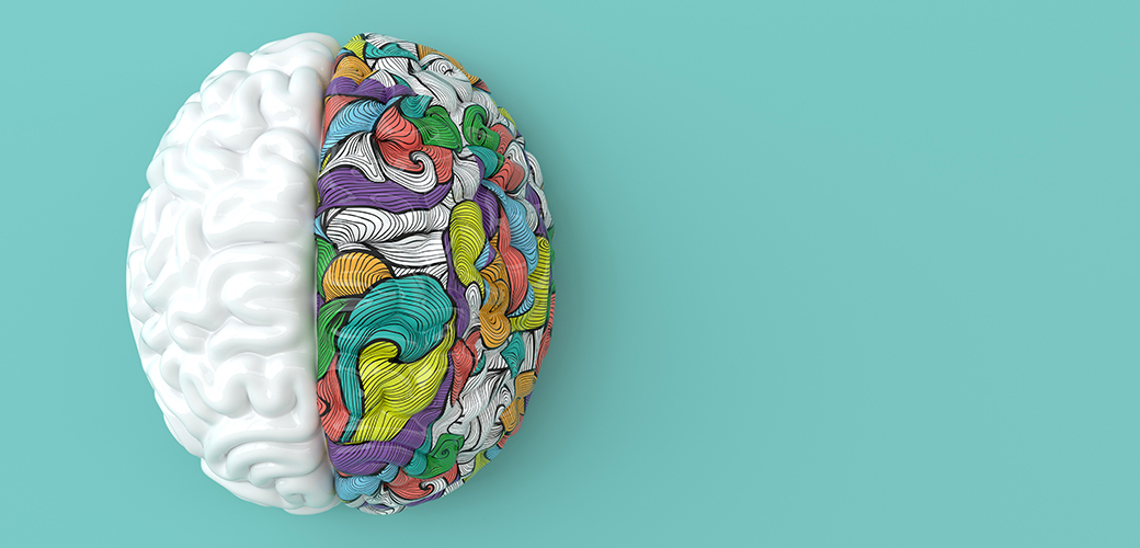 An illustration of the human brain with colourful patterns on the right hemisphere