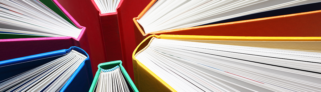 Books fanned out in a circle. Books fanned out in a circle.