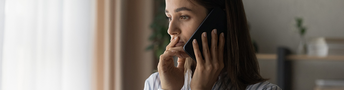 A person using a mobile phone to make a phone call. A person using a mobile phone to make a phone call.