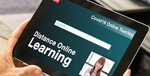 A tablet showing the words distance online learning