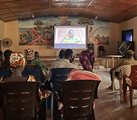 A preview screening of the film Tarma at a church hall in Kambia, Sierra Leone