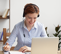 A person doing an online training course on a laptop